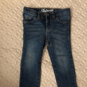 Medium wash toddler skinny jeans.